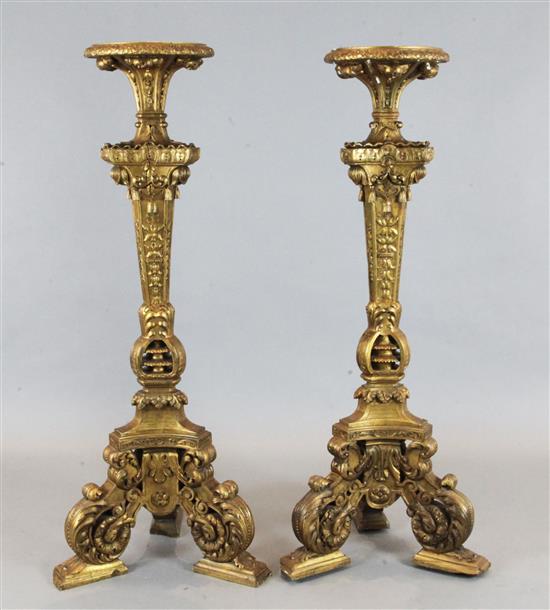 A pair of late 17th century giltwood and gesso torcheres, height 4ft 6in.